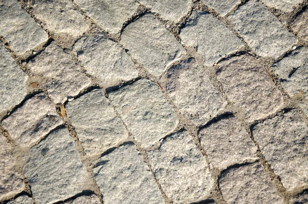 石で作られた都市道路 光の背景 — ストック写真