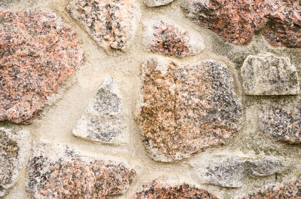 A relief wall from a natural wild stone antique as a background