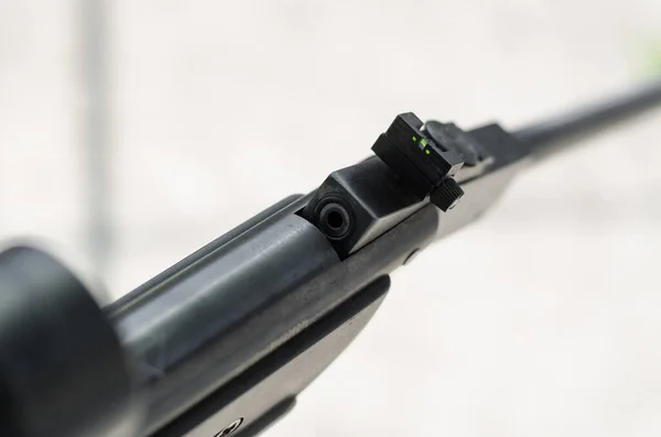 Detail of the breech of a classic air rifle. Closeup of opened air gun. Pellet has inserted to chamber. Open air rifle