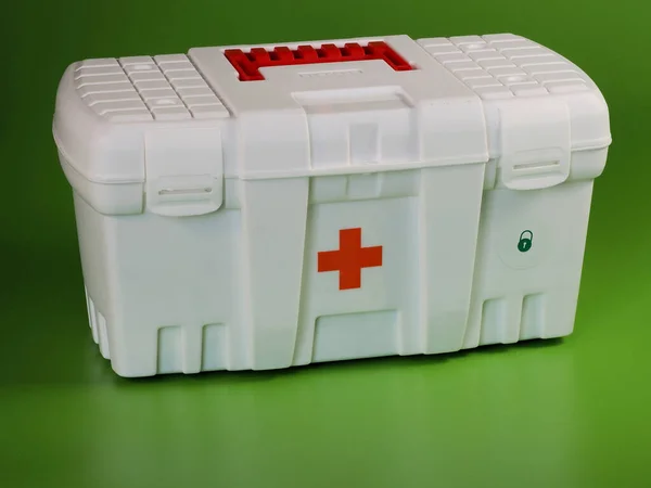 Medicine Box. First aid kit. On green background