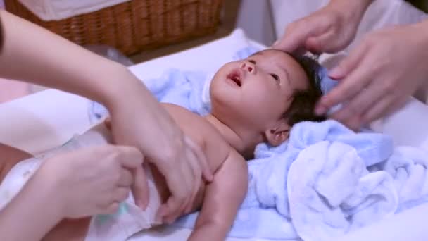 Asian Parent Put Diaper Infant Baby Girl Shower Home Warm — стоковое видео