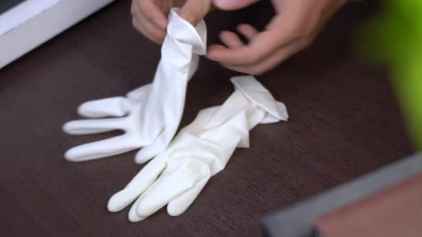 Man Hand Put White Elastic Glove Sanitation Cleaning Equipment Desinfektant — Stock video