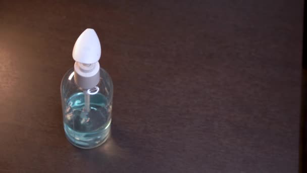 Blue Alcohol Gel Hand Sanitizer Bottle Isolated Object Wood Floor — Vídeo de Stock