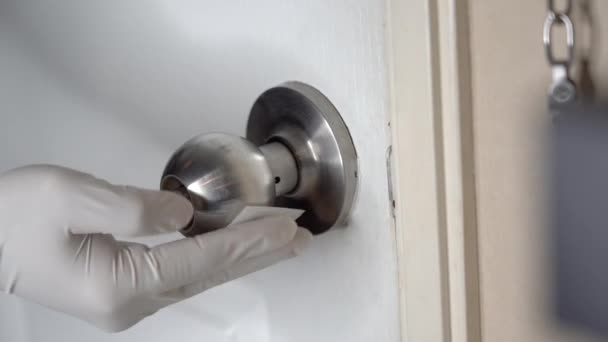 Hand Wearing White Glove Wiping Steel Doorknob Home White Color — Stock Video