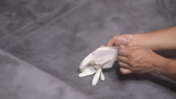 Asian Man Hand Wearing White Protective Glove One Hand Gray — Vídeo de Stock