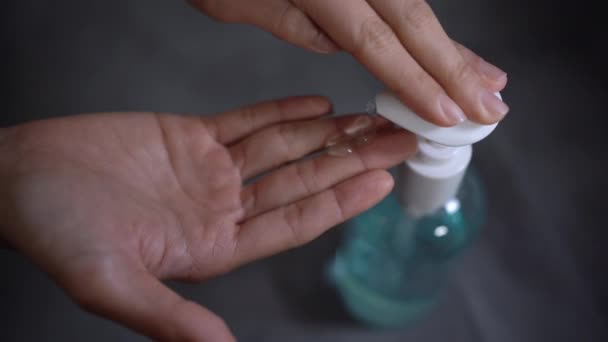 Asian Male Hand Use Sanitizer Gel Rubbing Hands Wood Desk — Stock Video