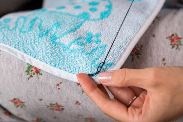 Seamstress sews up clothes — Stock Photo, Image