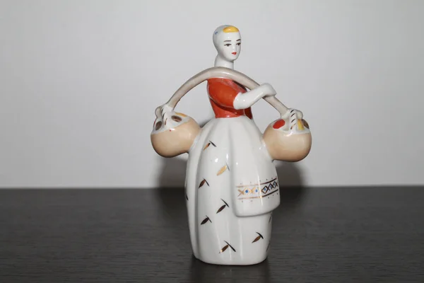 Porcelain Figurine Girl Carrying Fruit — Stock Photo, Image