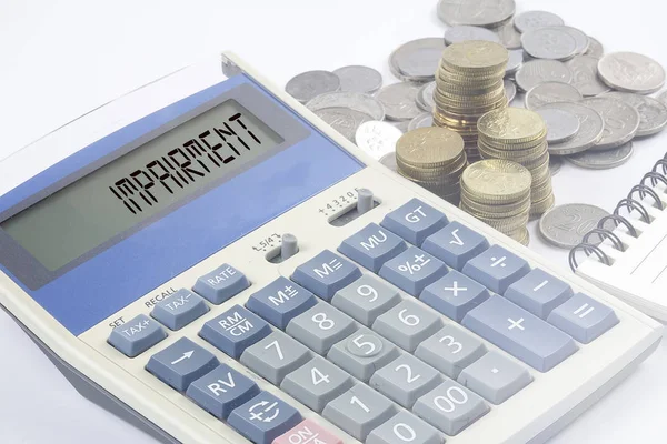 Coins and calculator with business and finance conceptual text. — Stock Photo, Image