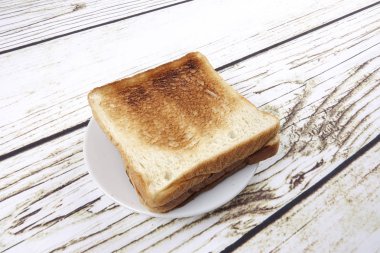 ekmek dilimleri üzerine eski rustik ahşap arka plan, üstten görünüm, kopya alanı, yatay kompozisyon