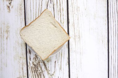 ekmek dilimleri üzerine eski rustik ahşap arka plan, üstten görünüm, kopya alanı, yatay kompozisyon