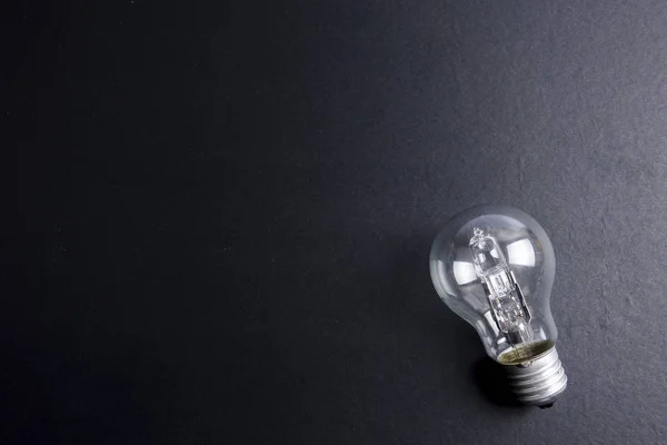 Idén Begrepp Ordet Idé Light Bulb Grå Bakgrund Svagt Ljus — Stockfoto