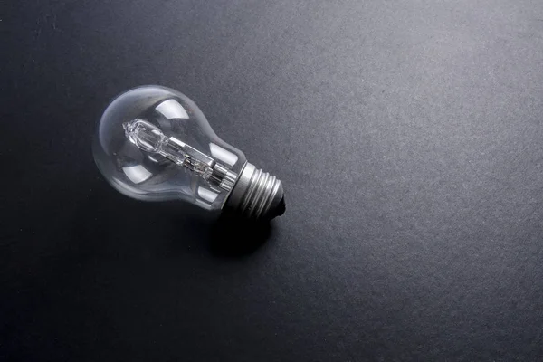 Idén Begrepp Ordet Idé Light Bulb Grå Bakgrund Svagt Ljus — Stockfoto