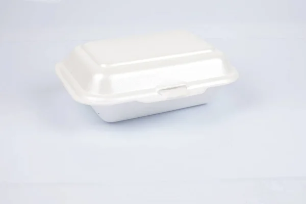 Unhealthy polystyrene lunch boxes with take away meal isolated on white background. — Stock Photo, Image