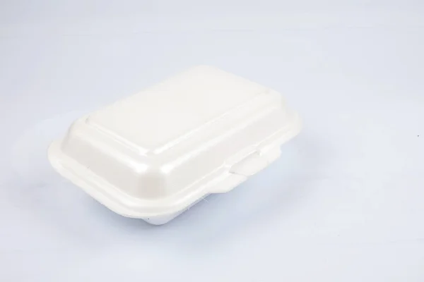Unhealthy polystyrene lunch boxes with take away meal isolated on white background. — Stock Photo, Image