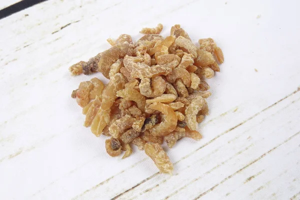 Dried shrimp isolated on wooden background — Stock Photo, Image