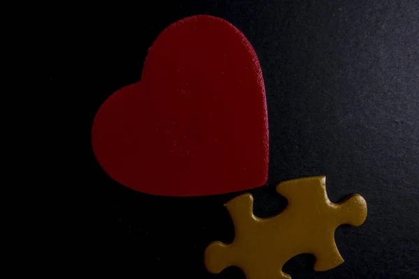 wooden heart shape and puzzle. Love concept