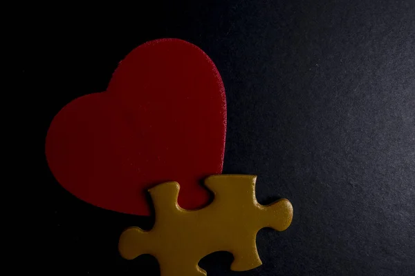 wooden heart shape and puzzle. Love concept