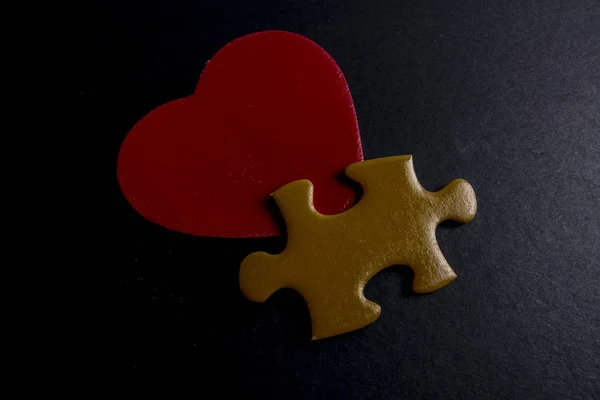 wooden heart shape and puzzle. Love concept