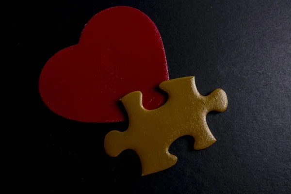 wooden heart shape and puzzle. Love concept