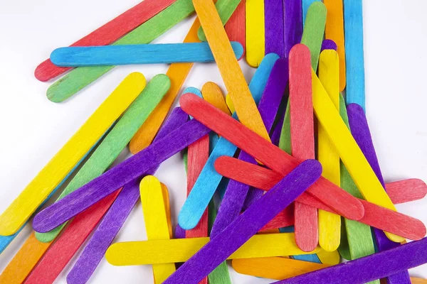 Colourful wooden sticks on white background — Stock Photo, Image