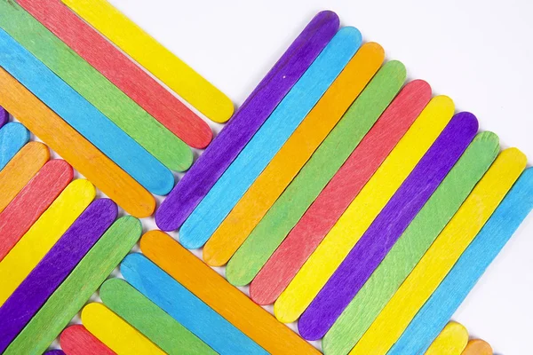 The arrangement of the colorful popsicle sticks isolated on white  background, Is simple activity for children and families. Stock Photo