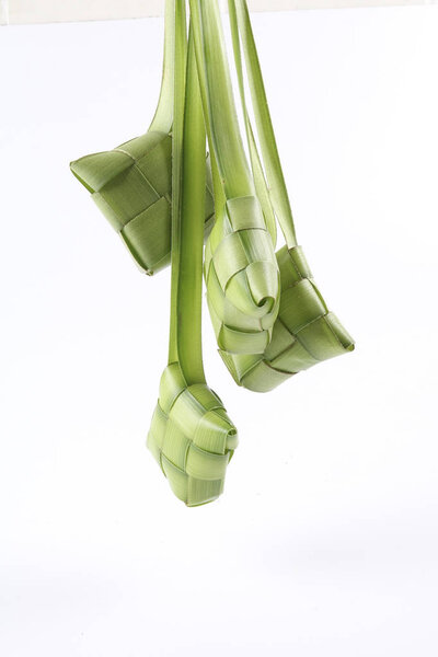 Making of Ketupat, a natural rice casing made from young coconut leaves for cooking rice