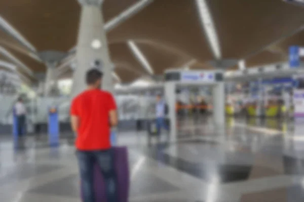 People at airport terminal blur background with bokeh light. — Stock Photo, Image