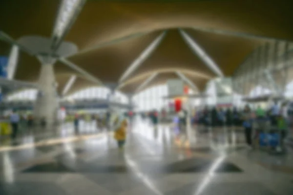 People at airport terminal blur background with bokeh light. — Stock Photo, Image