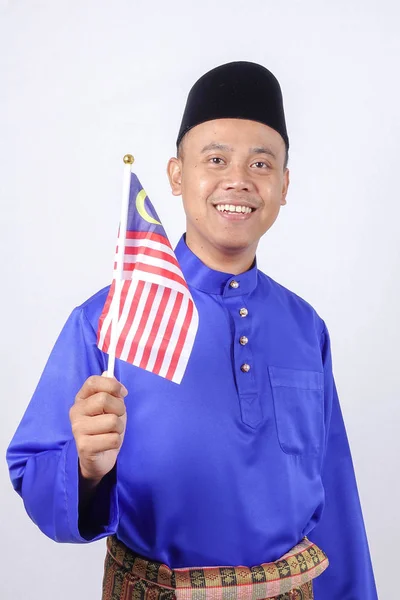 Asiatisk ung man med Malaysia flagg för nationaldagsfirande. — Stockfoto