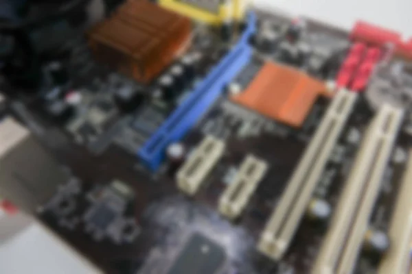 Verschwommene Nahaufnahme der Leiterplatte mit CPU-Prozessor. — Stockfoto