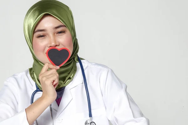 Smiling Female Doctor Holding Heart Shape Studio Portrait Isolated White — Stok Foto