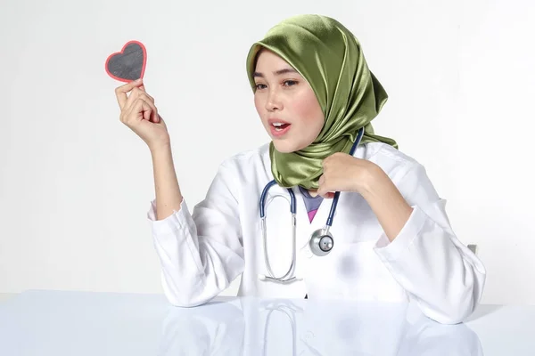 Smiling Female Doctor Holding Heart Shape Studio Portrait Isolated White — Stok Foto