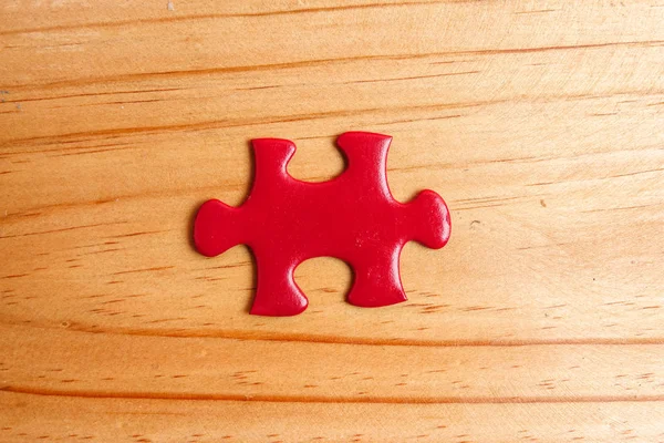 Missing Red Jigsaw Puzzle Wooden Table Copy Space — Stock Photo, Image
