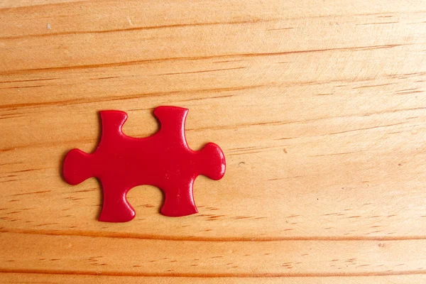 Missing Red Jigsaw Puzzle Wooden Table Copy Space — Stock Photo, Image