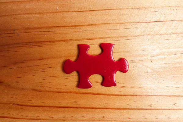 Missing Red Jigsaw Puzzle Wooden Table Copy Space — Stock Photo, Image