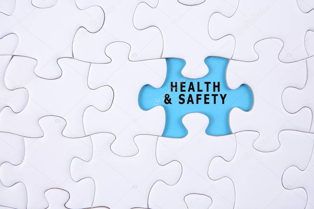 Health and safety concept: Missing piece of puzzle on white background