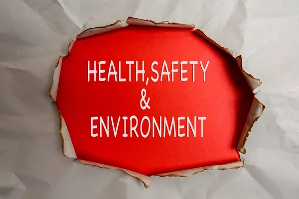 Zdrowia, bezpieczeństwa i środowiska koncepcja tekst o zwykły papier rozdarty. — Zdjęcie stockowe