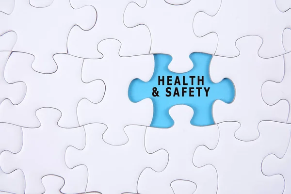 Health and safety concept: Missing piece of puzzle on white background