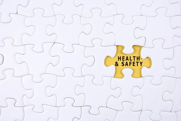 Health and safety concept: Missing piece of puzzle on white background