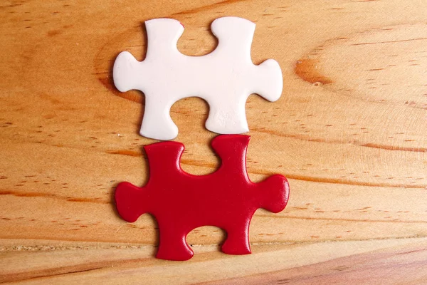 Missing jigsaw puzzle on wooden table. Copy Space