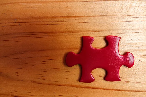 Missing Red Jigsaw Puzzle Wooden Table Copy Space — Stock Photo, Image