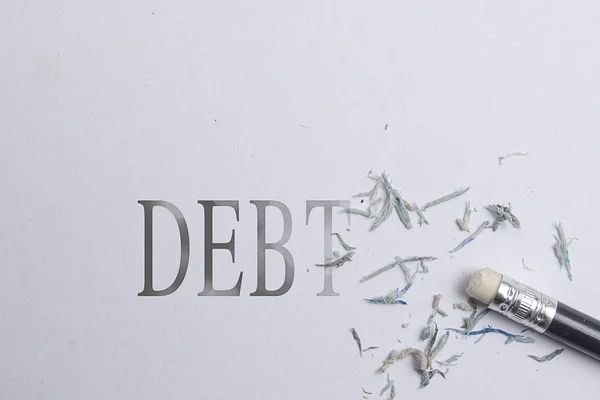 Pencil eraser with eraser. Erase DEBT text — Stock Photo, Image