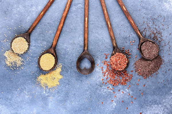 Collection of grains in wooden spoon — Stock Photo, Image