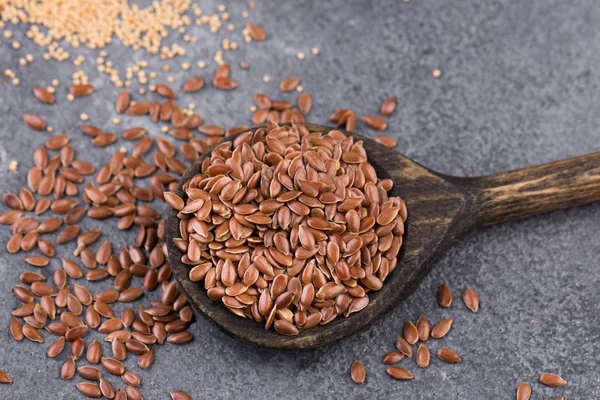 Collection of grains in wooden spoon — Stock Photo, Image