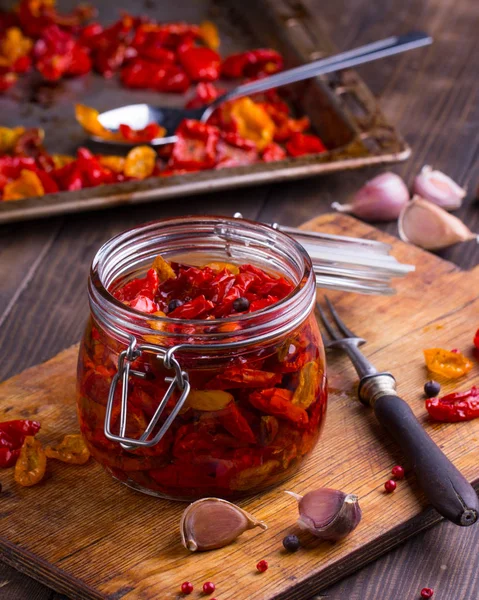 Sun dried tomatoes with olive oil in a jar — Stock Photo, Image