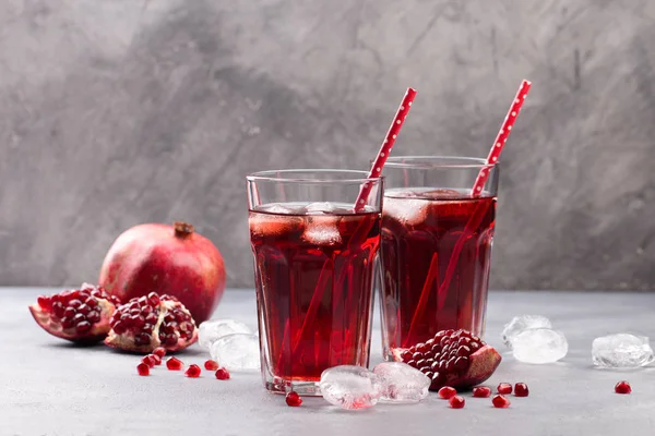 Fresh red lemonade with pomegranate and ice in glass — Stock Photo, Image