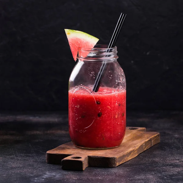 Fresh watermelon Smoothie in the Mason jar on dark background — Stock Photo, Image