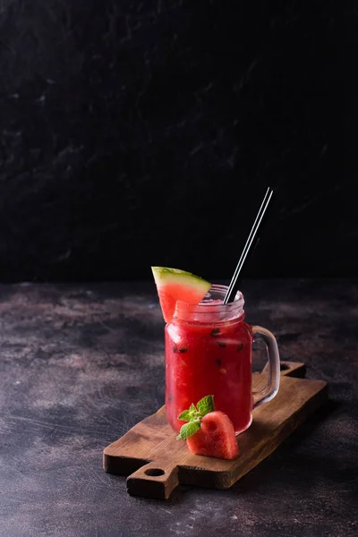 Fresh watermelon Smoothie in the Mason jar on dark background — Stock Photo, Image