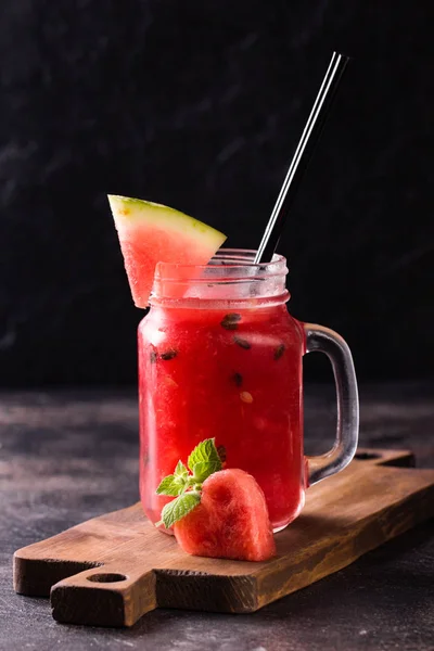 Fresh watermelon Smoothie in the Mason jar on dark background — Stock Photo, Image